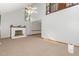 Spacious living room featuring a high ceiling, a classic fireplace, and ample natural light at 211 Dwelling Pl, Knightdale, NC 27545