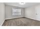 Spacious bedroom with carpeted floor and window at 257 Macallan Dr, Burlington, NC 27215