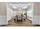 Elegant dining room with hardwood floors, chandelier, and art at 257 Macallan Dr, Burlington, NC 27215