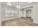 Spacious dining room with hardwood floors and large window at 257 Macallan Dr, Burlington, NC 27215