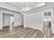 Open dining room, hardwood floors, views into kitchen and bathroom at 257 Macallan Dr, Burlington, NC 27215
