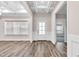 Bright and spacious entryway with coffered ceiling and wood floors at 257 Macallan Dr, Burlington, NC 27215
