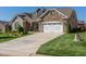 Two-story brick house with a two car garage and driveway at 257 Macallan Dr, Burlington, NC 27215