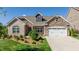 Brick house with a two-car garage and manicured lawn at 257 Macallan Dr, Burlington, NC 27215