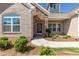 Front entry with stone accents and a charming door at 257 Macallan Dr, Burlington, NC 27215