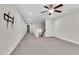 Upstairs hallway with carpet flooring and access to bedrooms at 257 Macallan Dr, Burlington, NC 27215