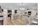 Open kitchen with breakfast bar and views into the living room at 257 Macallan Dr, Burlington, NC 27215