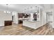 Modern kitchen with dark cabinets, granite counters, and island at 257 Macallan Dr, Burlington, NC 27215