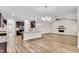 Open kitchen with island, dark cabinets, and hardwood floors at 257 Macallan Dr, Burlington, NC 27215