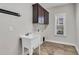 Convenient laundry room with utility sink and cabinets at 257 Macallan Dr, Burlington, NC 27215