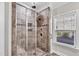 Spacious shower with tiled walls and built-in seat at 257 Macallan Dr, Burlington, NC 27215