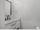 Modern bathroom with white vanity and black accents at 2635 Broad Oaks Pl, Raleigh, NC 27603