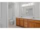 Bathroom boasts double sinks and wood cabinets at 2635 Broad Oaks Pl, Raleigh, NC 27603