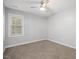 Bright bedroom with a window and ceiling fan at 2635 Broad Oaks Pl, Raleigh, NC 27603