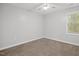 Well-lit bedroom featuring neutral walls and carpet at 2635 Broad Oaks Pl, Raleigh, NC 27603