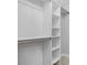 Large walk-in closet with shelves and hanging rods at 2635 Broad Oaks Pl, Raleigh, NC 27603