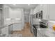 Modern kitchen with stainless steel appliances and white cabinets at 2635 Broad Oaks Pl, Raleigh, NC 27603