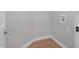 Simple laundry room with wood flooring at 2635 Broad Oaks Pl, Raleigh, NC 27603