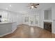 Open living space with hardwood floors, kitchen island and fireplace at 2635 Broad Oaks Pl, Raleigh, NC 27603