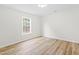 Bright bedroom with wood floors and a large window at 2730 Erinridge Rd, Raleigh, NC 27610