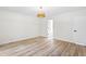 Bedroom with wood floors and access to another room at 2730 Erinridge Rd, Raleigh, NC 27610