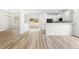 Dining area with chandelier and view into the living room and kitchen at 2730 Erinridge Rd, Raleigh, NC 27610