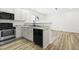 Modern kitchen with stainless steel appliances and granite countertops at 2730 Erinridge Rd, Raleigh, NC 27610