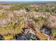 High-angle view of a house among other homes in a wooded area at 3667 Jordan Cir, Franklinton, NC 27525