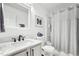 Bathroom featuring modern vanity with marble countertop and shower-tub combination at 501 Pearson Dr, Durham, NC 27713