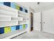 Bedroom with built-in shelving along one wall with cubbies and an adjacent closet at 501 Pearson Dr, Durham, NC 27713