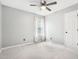 Cozy bedroom featuring a ceiling fan, plush carpet, and soft natural light at 501 Pearson Dr, Durham, NC 27713