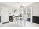 Eat-in kitchen with dining table and chairs, stylish lighting, and view of the yard at 501 Pearson Dr, Durham, NC 27713