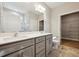 Bathroom with double vanity, quartz countertop and walk-in closet access at 5394 Salem Woods Dr # 16, Graham, NC 27253