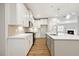 Modern kitchen featuring stainless steel appliances and white cabinets at 5394 Salem Woods Dr # 16, Graham, NC 27253