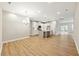 Spacious kitchen and dining area with light hardwood floors at 5394 Salem Woods Dr # 16, Graham, NC 27253