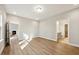 Spacious main bedroom with wood floors and doorways to the living spaces and bathroom at 5394 Salem Woods Dr # 16, Graham, NC 27253