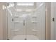 Modern white shower with glass doors and shelving at 5394 Salem Woods Dr # 16, Graham, NC 27253