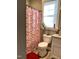 Bathroom with pink and white candy cane shower curtain at 55 Running Deer Path, Timberlake, NC 27583
