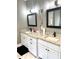 Modern bathroom featuring double vanities with granite countertops and black framed mirrors at 55 Running Deer Path, Timberlake, NC 27583