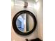 Bathroom with a large round mirror and modern vanity at 55 Running Deer Path, Timberlake, NC 27583