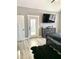 Main bedroom with a king-size bed and access to a deck at 55 Running Deer Path, Timberlake, NC 27583