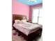 Charming bedroom with pink walls and a full-size bed at 55 Running Deer Path, Timberlake, NC 27583