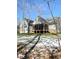 Gray house exterior with a large backyard and screened porch at 55 Running Deer Path, Timberlake, NC 27583
