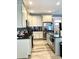 Modern kitchen with white cabinets, stainless steel appliances, and an island at 55 Running Deer Path, Timberlake, NC 27583