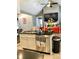Island kitchen with stainless steel appliances and view into living room at 55 Running Deer Path, Timberlake, NC 27583