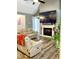 Spacious living room with a large TV, fireplace, and beige sofas at 55 Running Deer Path, Timberlake, NC 27583
