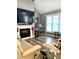Living room with a fireplace, large TV, and ample seating at 55 Running Deer Path, Timberlake, NC 27583