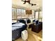 Screened porch with hot tub and outdoor furniture at 55 Running Deer Path, Timberlake, NC 27583
