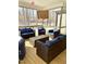 Relaxing screened porch with wicker furniture and wooded views at 55 Running Deer Path, Timberlake, NC 27583