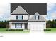 Two-story house with gray shake siding, double garage, and landscaping at 65 Tuskeegee Dr, Smithfield, NC 27577